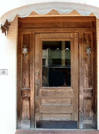 Front door of the Miller Furniture Store at 201 Sount Adams in Welsh, Louisana; photograph taken in 2003 by Ron Cook