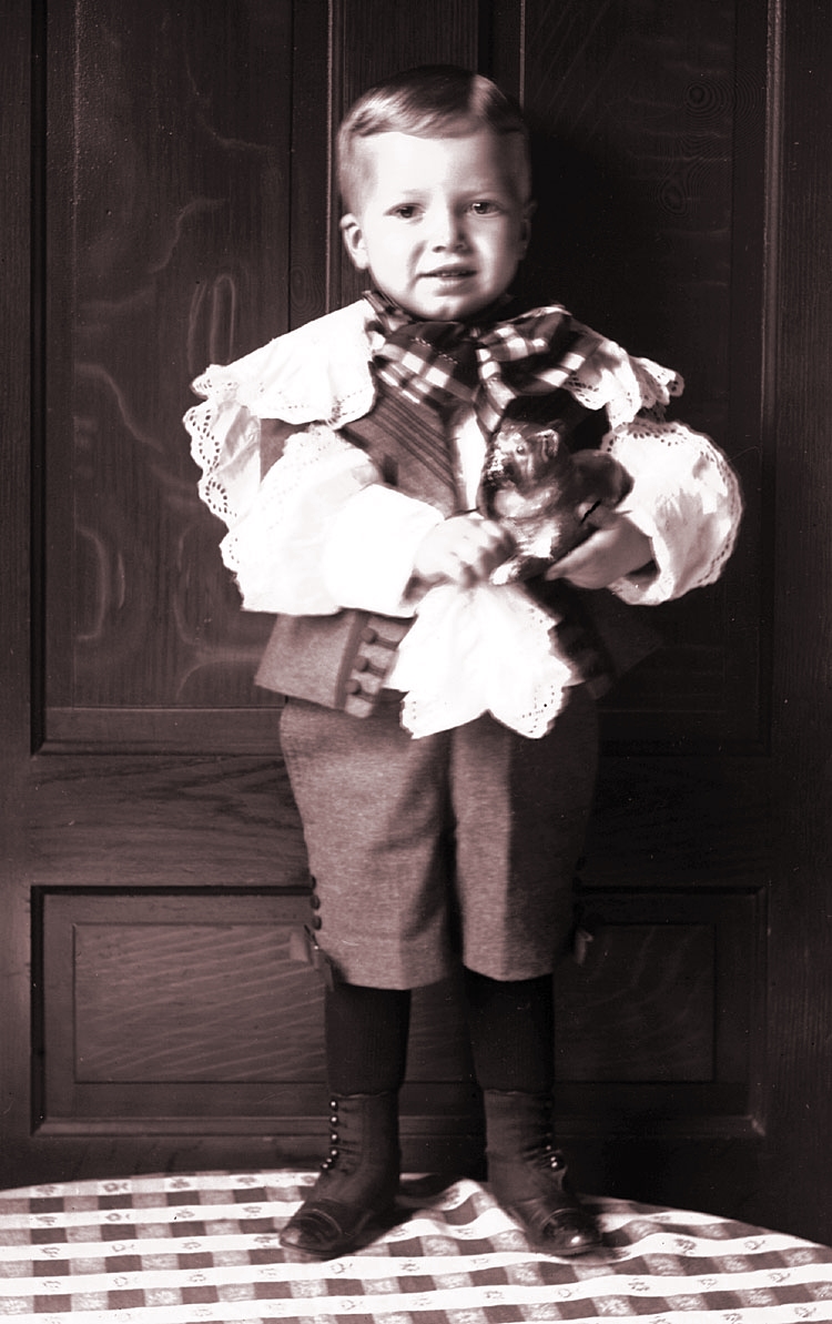 James Lee Fisher in a Dress standing on a chair, ca. 1897